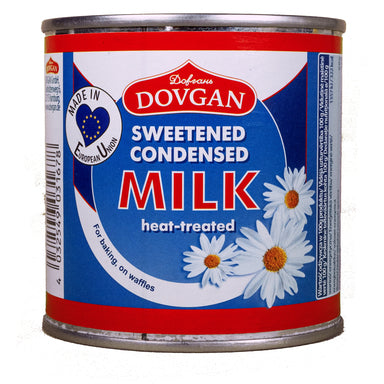 Dovgan sweetened condensed milk can with daisy flowers on a white background