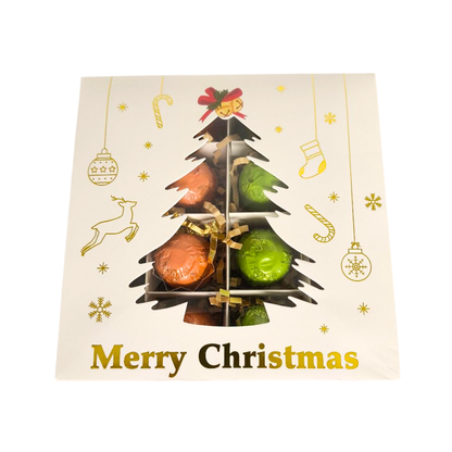 Pack of chocolates shaped like a Christmas tree with 'Merry Christmas' text on a decorative card.