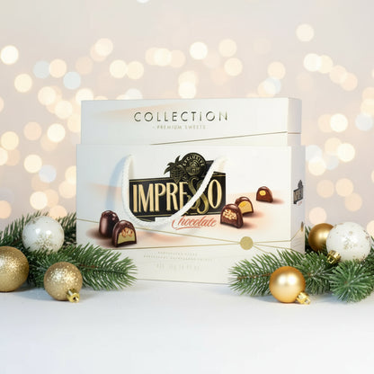 A gift set of IMPRESSO Premium white chocolates with a weight of 424g, featuring a minimalist design with the brand and product name on the packaging.